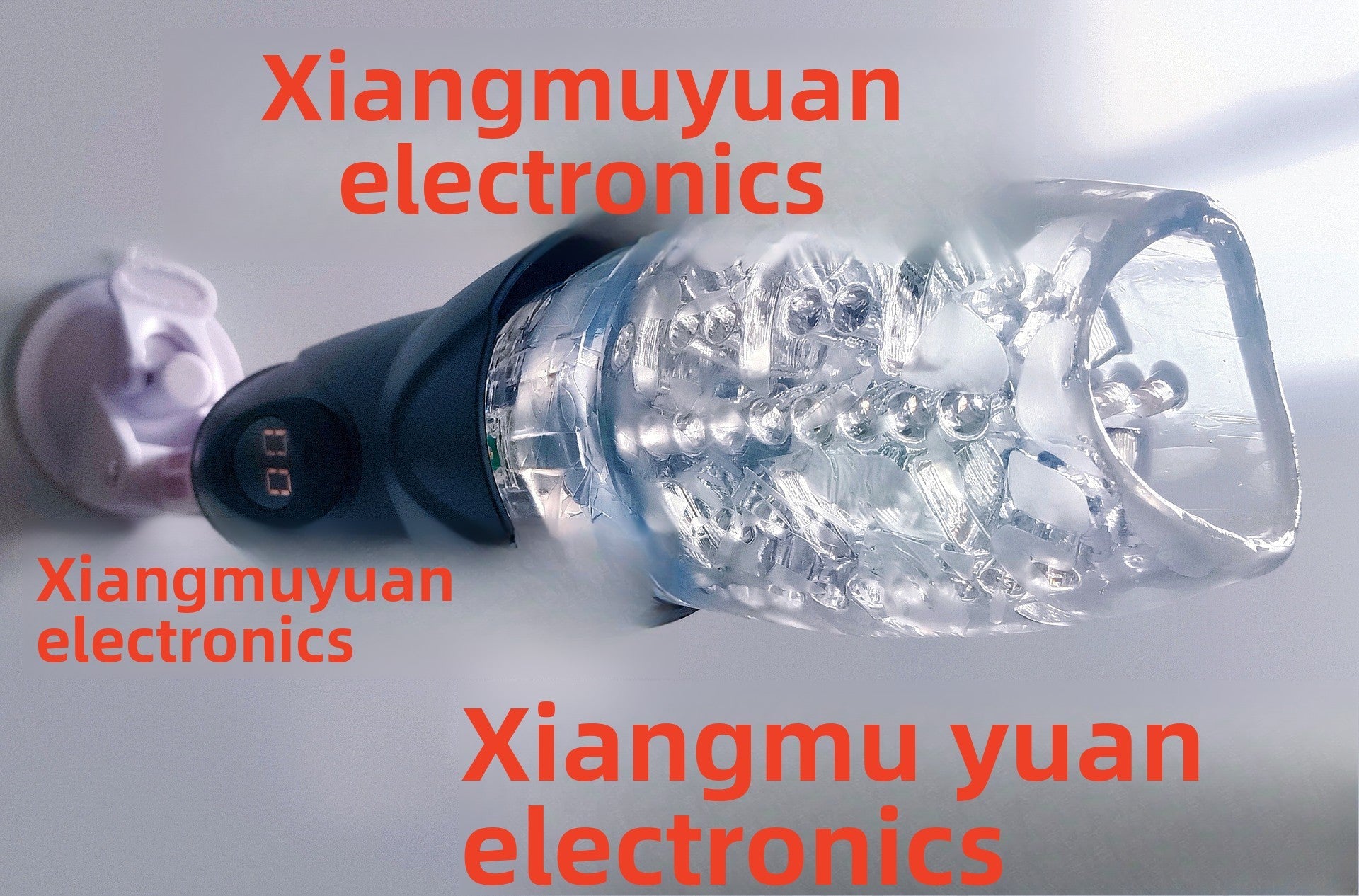 Close-up of transparent rotating sleeve of electric male masturbator by Xiangmuyuan Electronics, showcasing internal textures and suction cup.